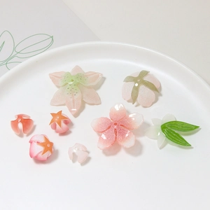 Close-up of pink and green resin flower petals for DIY jewelry and hair accessories