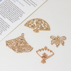 Golden fan-shaped hollow flower and butterfly charms for DIY jewelry making and crafts