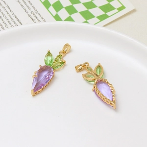 Detailed view of two purple crystal carrot pendants with green leaves and gold metal clasps