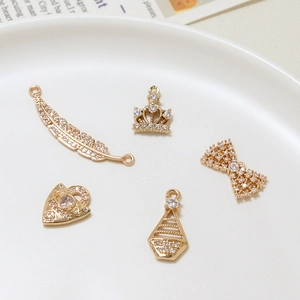 Five-piece gold copper zircon charms set with crown feather bow heart and triangle shapes