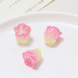 Macro detail of 3D resin rose flower charms for DIY jewelry and hair accessories