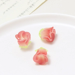 Macro view of 3D resin rose flower charms for DIY handmade jewelry and hair accessories