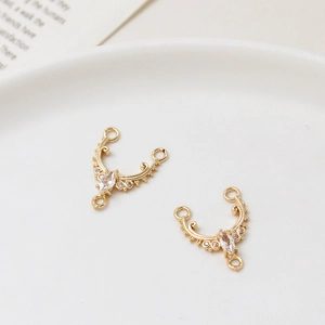 Detail of DIY zircon marquise stone connector with vintage gold scrollwork for jewelry