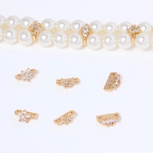 Detail of copper gold-plated spacer beads with zircons for DIY jewelry making