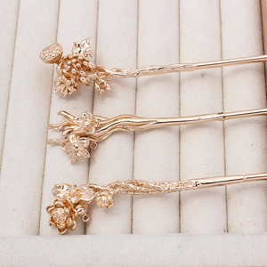 Three-piece rose gold floral hairpins set with traditional Chinese flower designs
