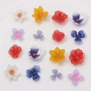Macro shot of colorful resin flower beads with center holes for DIY jewelry making