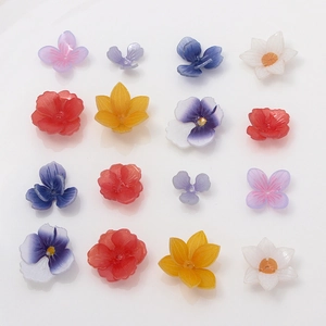 Detailed grid view of assorted resin flower charms for DIY jewelry and hair accessories