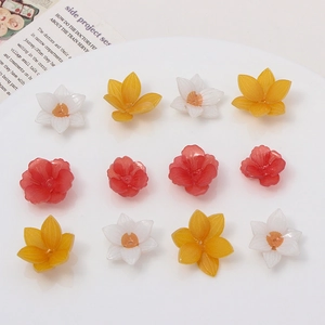Macro detail of yellow and white plumeria flower beads with hole for DIY jewelry making