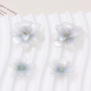 Close-up of translucent blue and white gradient lotus flower DIY jewelry components