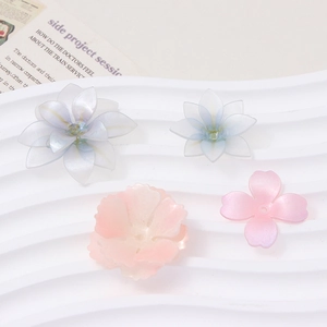 Macro detail of handmade gradient resin flower petals for DIY jewelry hairpins