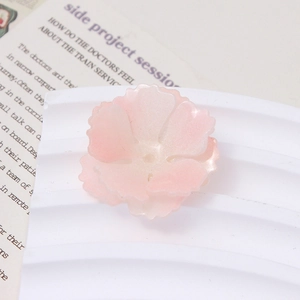 Macro shot of 3D pink gradient shrink plastic flower accessories for DIY hairpins