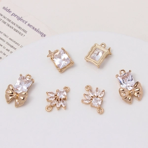 Set of six gold-plated crystal bow and heart charms for DIY jewelry making kits
