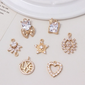 Sparkling crystal bow and heart pendants in gold plated alloy for DIY jewelry making