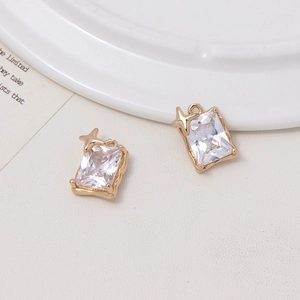 Detail of rectangular crystal pendants with gold star accents for DIY jewelry making