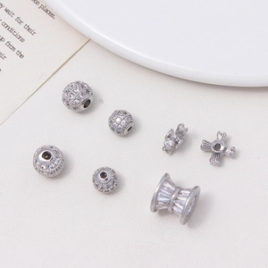 Macro shot of silver-plated copper beads with micro-pave cubic zirconia for DIY jewelry