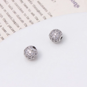 Macro shot of micro-pave cubic zirconia silver charms for DIY jewelry making