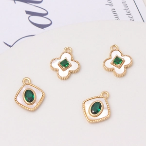 Four-piece shell flower pendants with gold plating and green gemstones for DIY jewelry