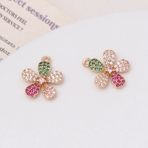 Detailed view of colorful pavé zircon flower charms with gold alloy base for DIY jewelry