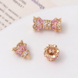 Macro detail of 14K gold-plated screw clasp and heart-shaped zircon crown connector