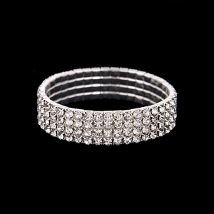 Sparkling four-row crystal stretch bracelet with silver plating on black background