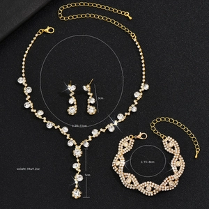 Elegant bridal jewelry set with sparkling crystals including necklace, bracelet and earrings