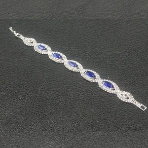 Elegant silver-plated bridal bracelet featuring marquise-cut blue stones and crystals