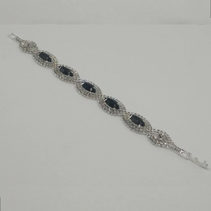 Silver plated bridal bracelet featuring navy blue marquise stones and crystal halo details