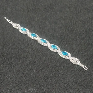 Silver plated chain bracelet with five marquise-cut blue stones and inlaid diamonds