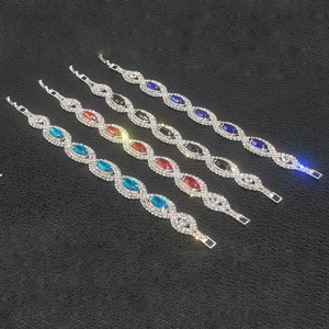 Macro shot of silver-plated bracelets featuring marquise-cut stones in four vibrant colors