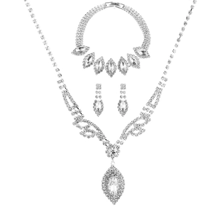 Silver bridal jewelry set with marquise stones including necklace, bracelet and earrings