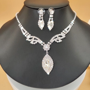 Silver bridal jewelry set featuring marquise-cut zircon necklace and drop earrings
