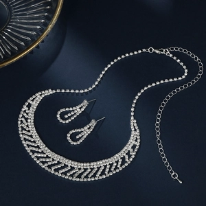 Detailed macro view of sparkling rhinestone bridal necklace and matching earrings set