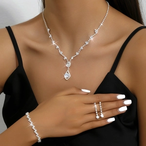 Silver fringe jewelry set with necklace earrings and bracelet on elegant female model