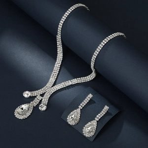Elegant silver bridal jewelry set with sparkling teardrop rhinestones on dark base