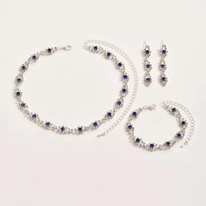 Elegant silver jewelry set with blue rhinestones including necklace, bracelet and earrings