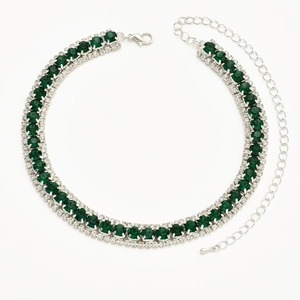 Elegant three-row silver necklace featuring emerald green stones and sparkling crystals