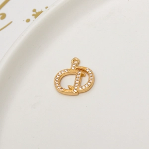 Macro shot of 18K gold plated brass D letter pendant with micro-pave white zircon