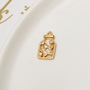 Exquisite gold baby bottle pendant with zircon pavé and inner star charm detail