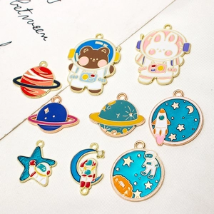 Set of 9 colorful enamel space charms featuring astronauts, planets, and rockets for DIY jewelry
