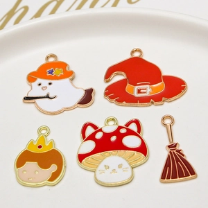 Detailed view of Halloween enamel charms with ghost, wizard hat, and mushroom designs