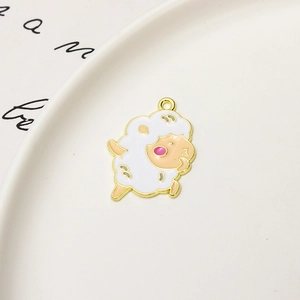 Close-up of a cute white enamel cartoon sheep charm for DIY jewelry and bracelets
