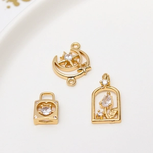 Golden moon, heart, and floral pendants with sparkling cubic zirconia for DIY jewelry