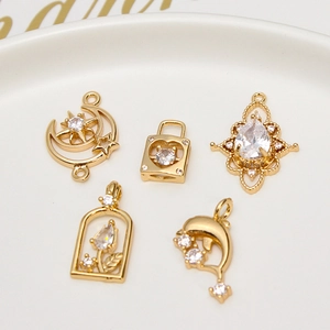 Macro view of gold-plated copper charms with cubic zirconia for DIY jewelry making