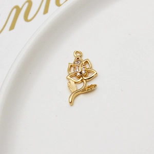 Macro view of gold rose flower pendant with cubic zirconia for DIY jewelry making
