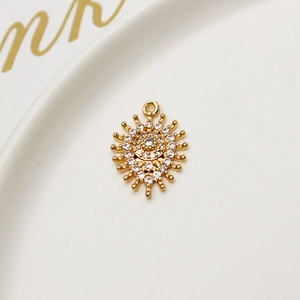 Macro view of gold copper evil eye sunburst pendant with micro-set zircon stones