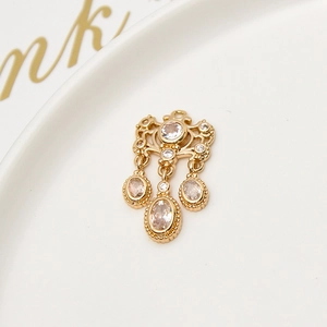 Macro shot of gold-plated chandelier pendant with cubic zirconia for jewelry making