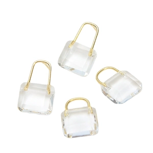 Lot de quatre breloques sac à main en cristal transparent avec anses en métal doré