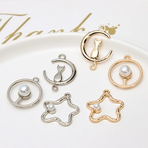 Golden and silver alloy charms with pearls in cat, moon, and star shapes for DIY jewelry