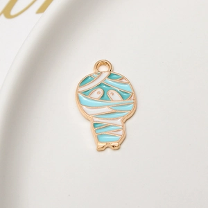 Detail of cartoon mummy enamel pendant for DIY jewelry making and craft charms