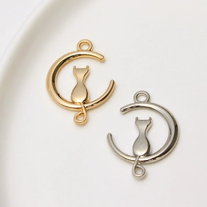 Detail showing cat and moon jewelry pendants in gold and silver finish for DIY crafting